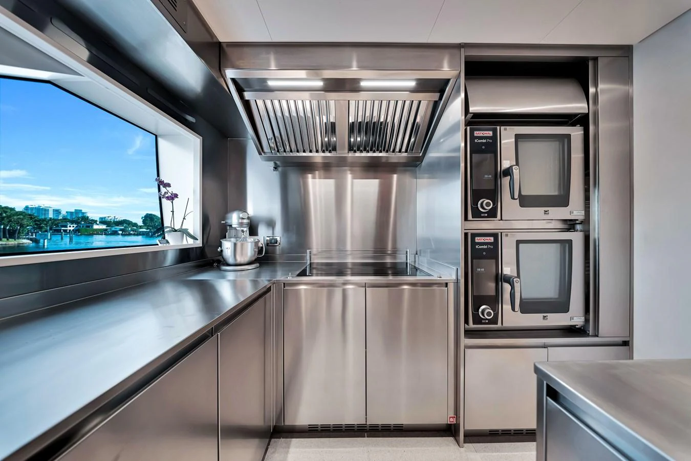 The yacht's galley features modern stainless steel appliances and a sleek, functional design. aboard BAGLIETTO DOM 133 #5 Yacht for Sale