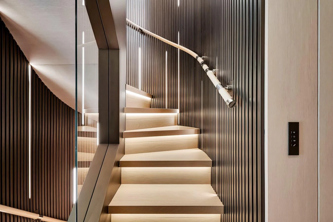 A modern staircase with sleek lighting and elegant design elements. aboard BAGLIETTO DOM 133 #5 Yacht for Sale