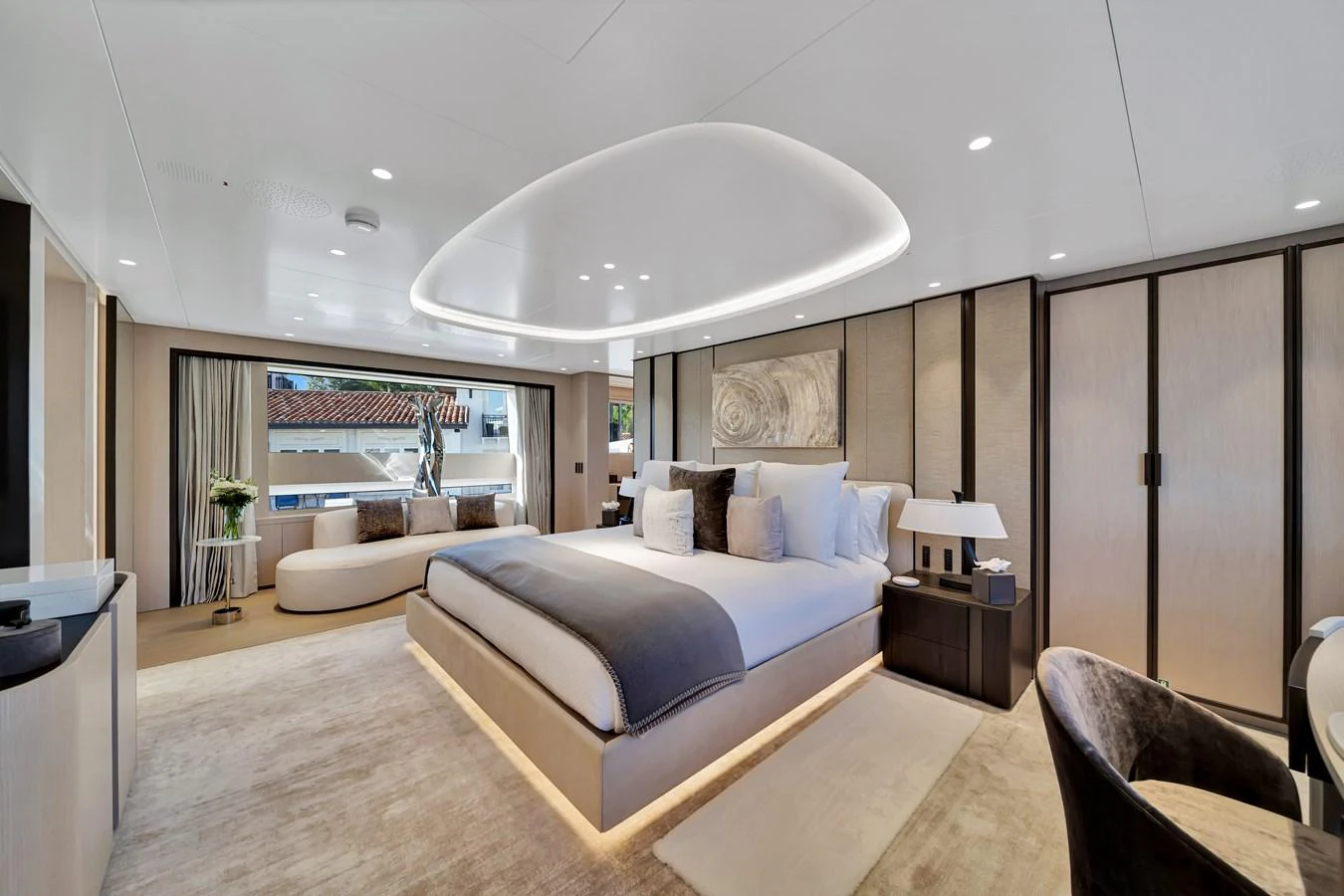 The master stateroom exudes luxury with its spacious layout, elegant furnishings, and ambient lighting. aboard BAGLIETTO DOM 133 #5 Yacht for Sale