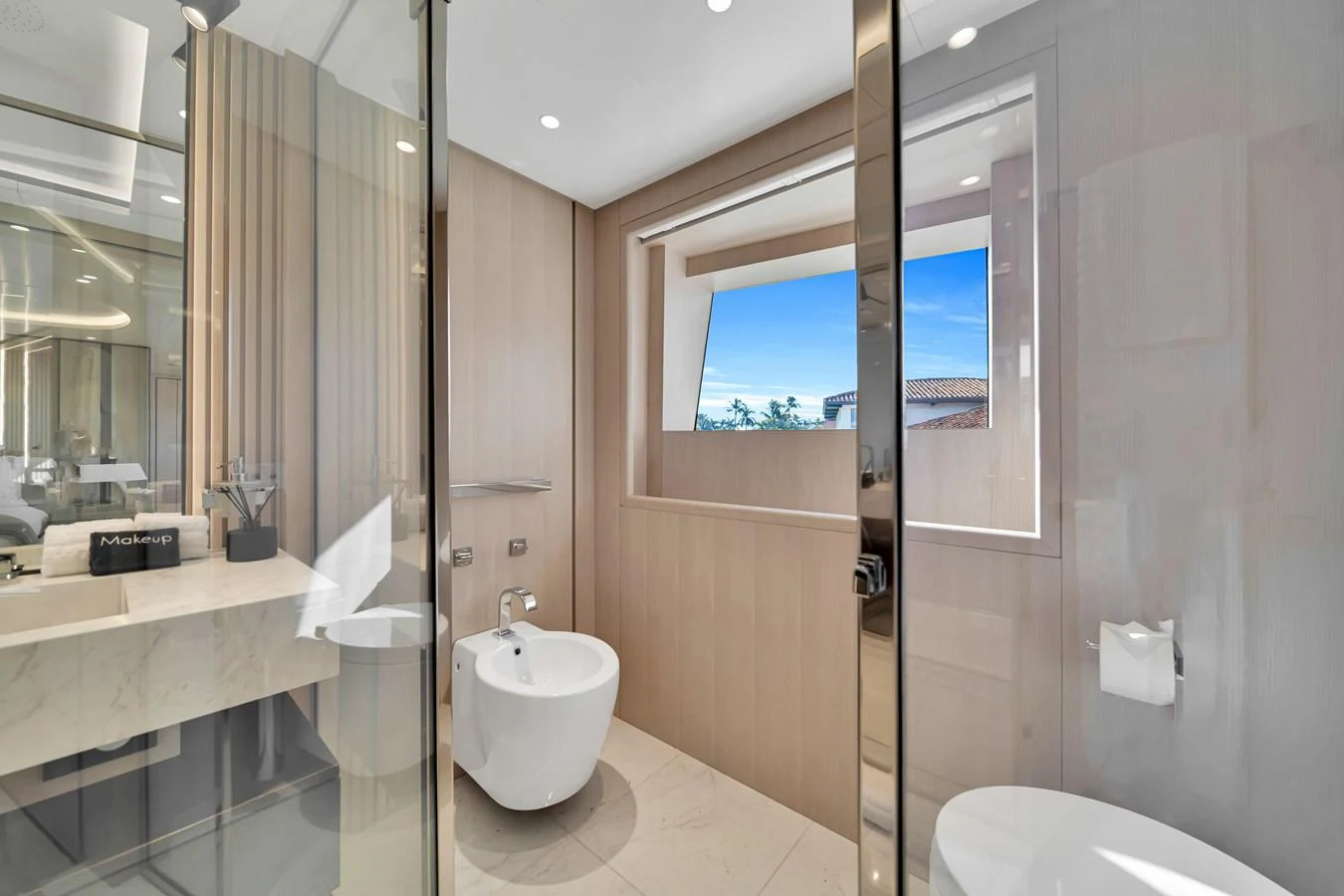 The yacht's bathroom features modern fixtures and a large window with a view. aboard BAGLIETTO DOM 133 #5 Yacht for Sale