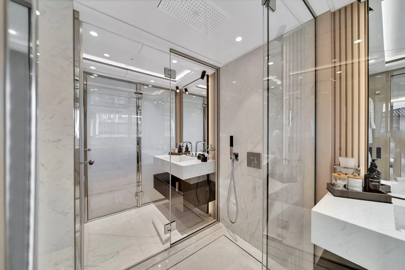 The yacht's bathroom features a sleek, modern design with high-end fixtures and ample natural light. aboard BAGLIETTO DOM 133 #5 Yacht for Sale