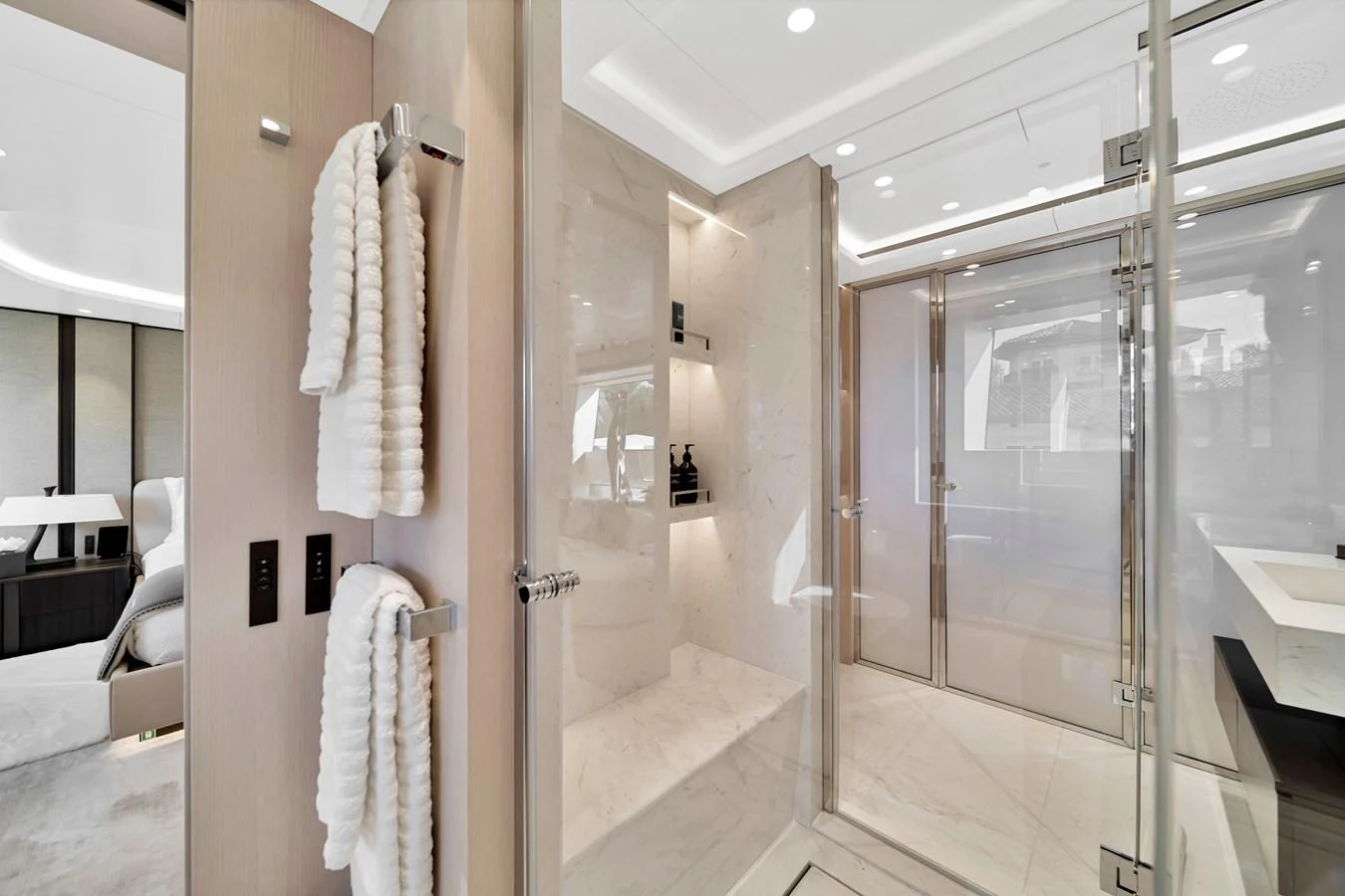 The yacht's bathroom features a luxurious shower area with elegant fixtures and plush towels. aboard BAGLIETTO DOM 133 #5 Yacht for Sale