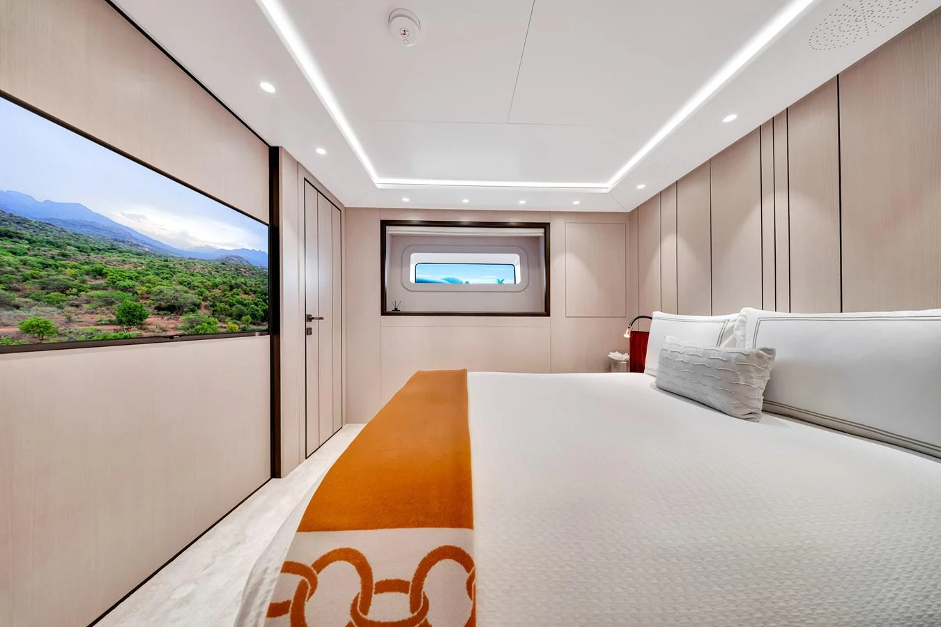 A luxurious stateroom featuring a large bed, elegant decor, and scenic views through the windows. aboard BAGLIETTO DOM 133 #5 Yacht for Sale
