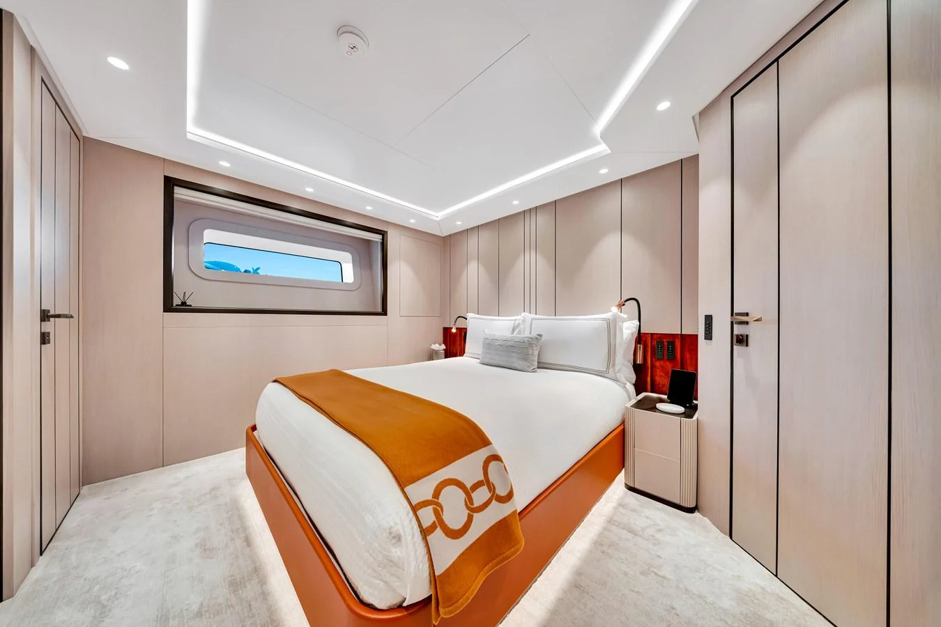 A luxurious stateroom featuring a large bed with elegant bedding and modern lighting. aboard BAGLIETTO DOM 133 #5 Yacht for Sale
