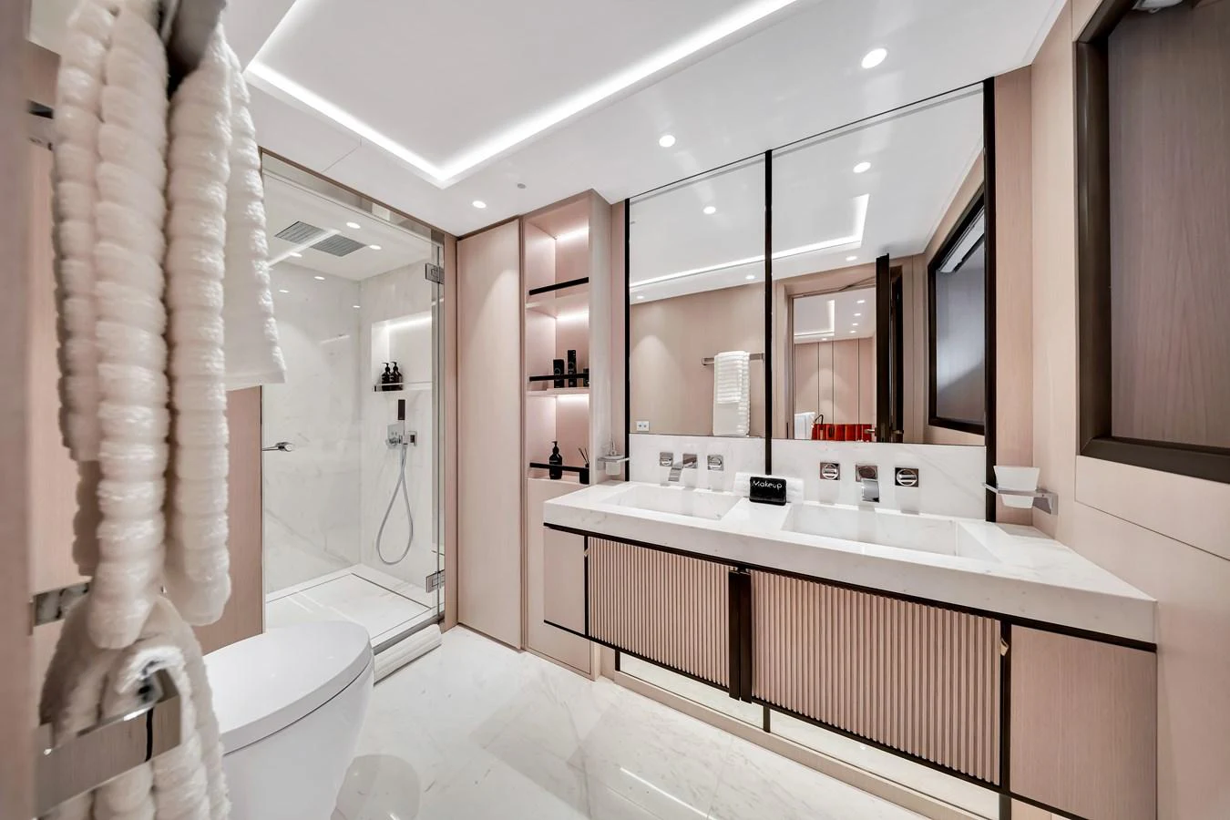 The yacht's bathroom features a spacious and modern design with elegant fixtures and ample lighting. aboard BAGLIETTO DOM 133 #5 Yacht for Sale