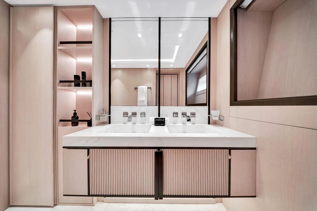 The yacht's bathroom features a sleek, modern design with dual sinks and ample storage. aboard BAGLIETTO DOM 133 #5 Yacht for Sale