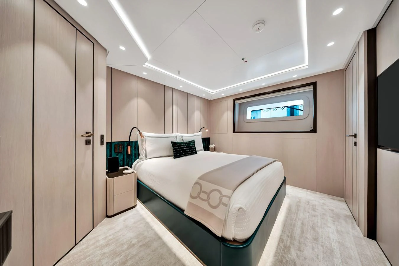 The stateroom features a luxurious bed with modern lighting and ample storage space. aboard BAGLIETTO DOM 133 #5 Yacht for Sale