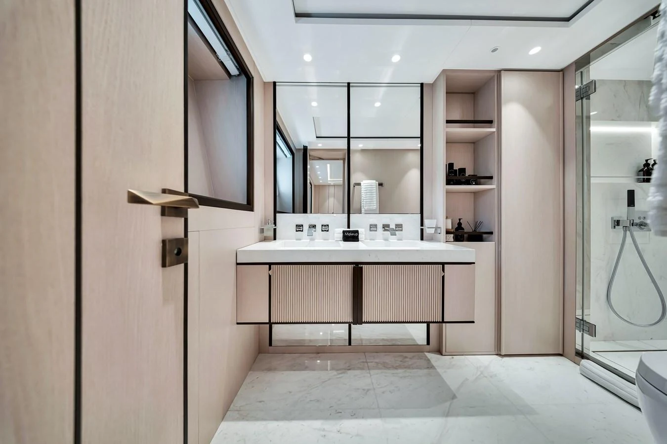 The yacht's bathroom features a sleek, modern design with ample storage and luxurious fixtures. aboard BAGLIETTO DOM 133 #5 Yacht for Sale