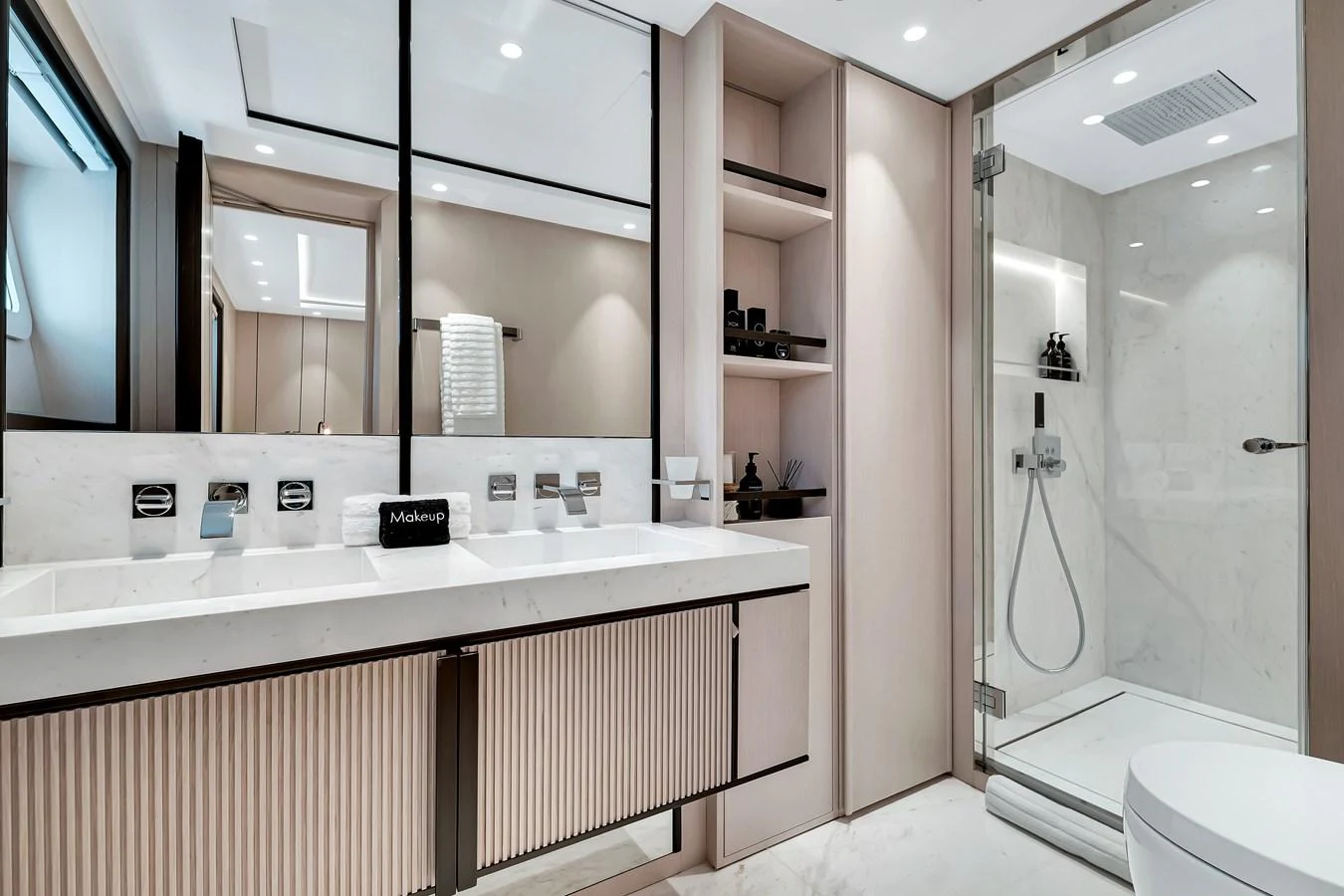 The yacht's bathroom features a sleek design with modern fixtures and ample storage. aboard BAGLIETTO DOM 133 #5 Yacht for Sale