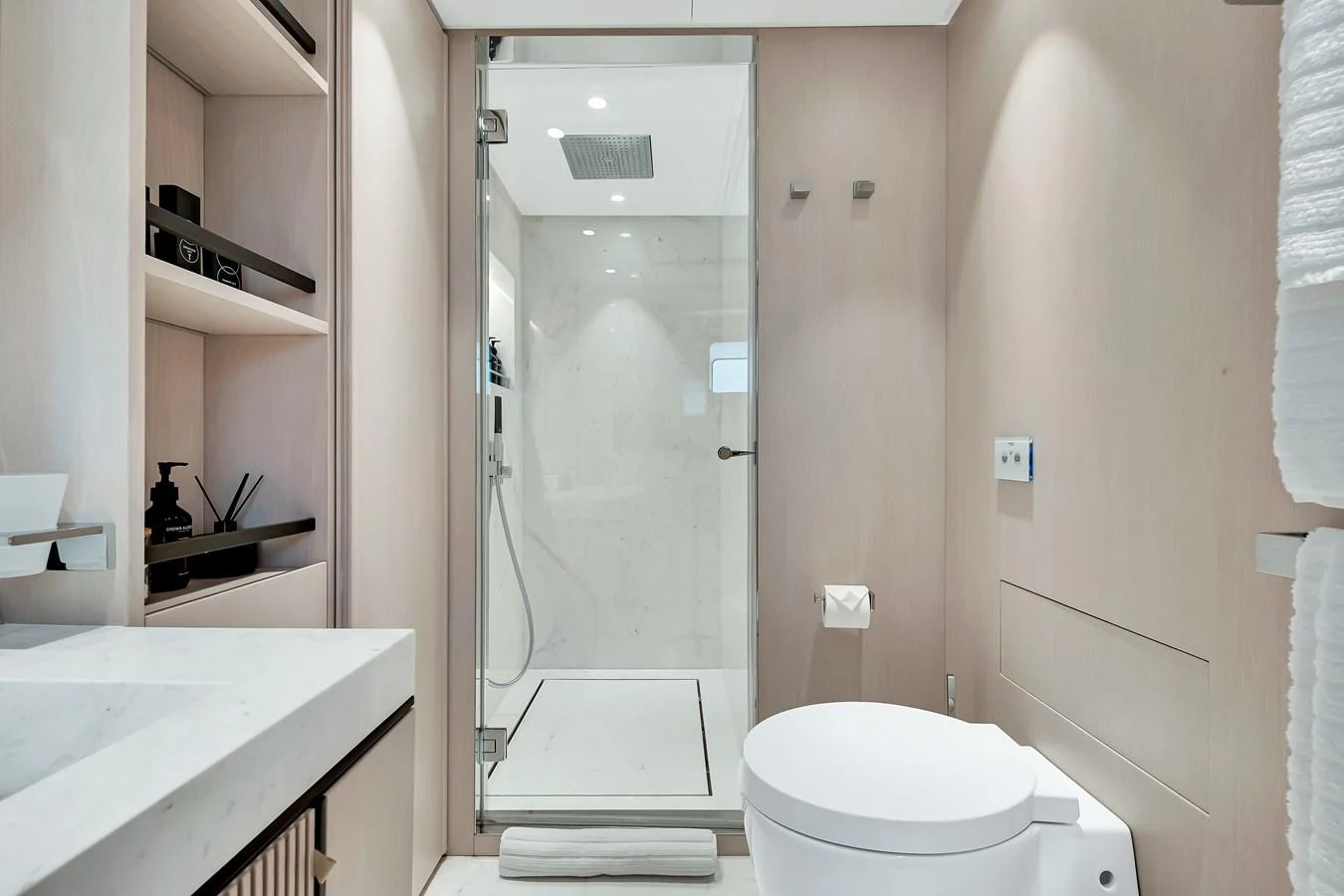 A sleek and modern yacht bathroom with a glass-enclosed shower and contemporary fixtures. aboard BAGLIETTO DOM 133 #5 Yacht for Sale