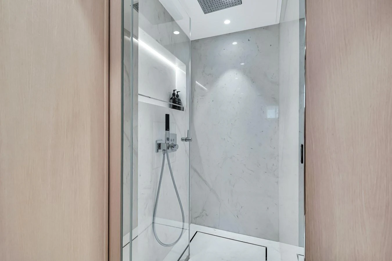 The yacht's bathroom features a sleek, modern shower with elegant marble walls and high-end fixtures. aboard BAGLIETTO DOM 133 #5 Yacht for Sale