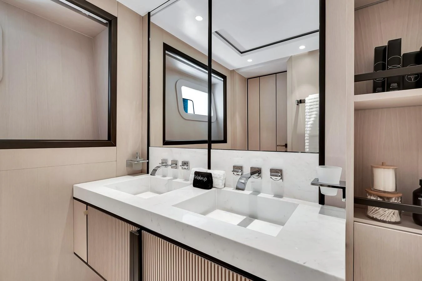 A luxurious yacht bathroom featuring a double sink vanity and modern fixtures. aboard BAGLIETTO DOM 133 #5 Yacht for Sale
