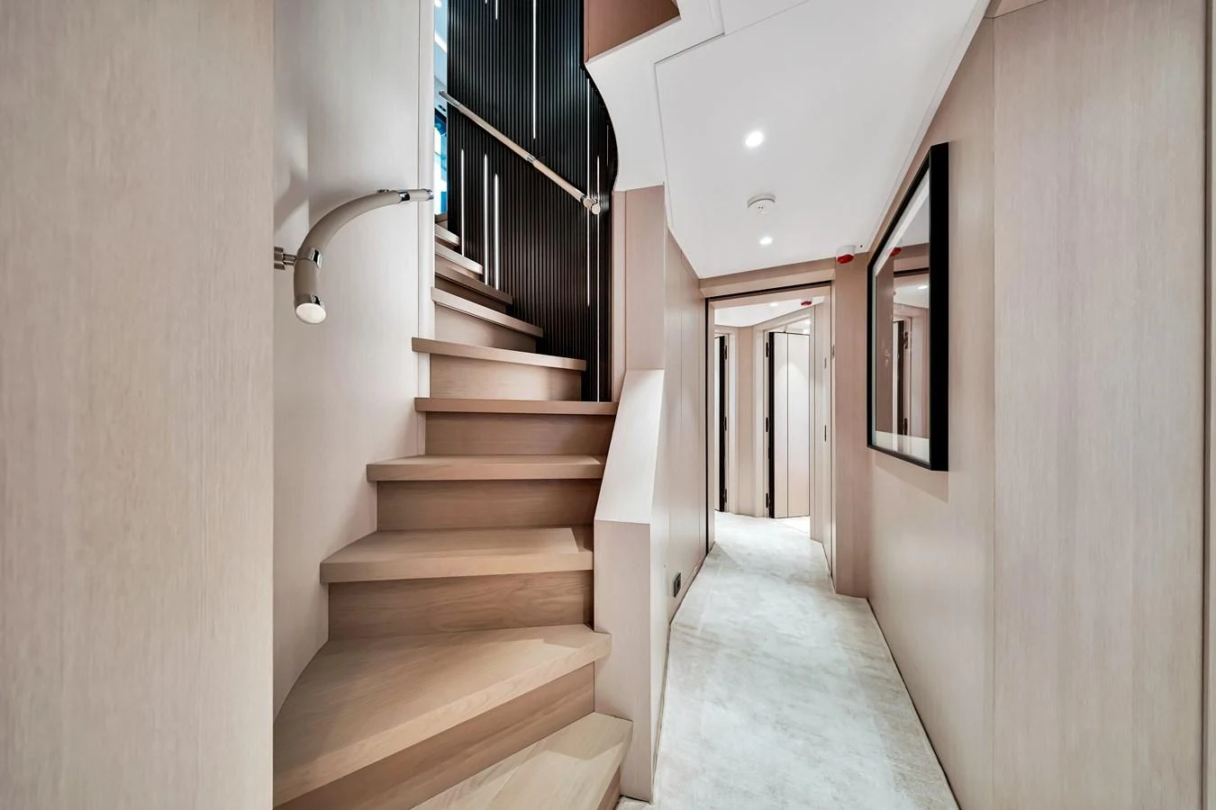A modern and elegant staircase leads to the lower deck of the yacht, showcasing sleek design and high-quality materials. aboard BAGLIETTO DOM 133 #5 Yacht for Sale