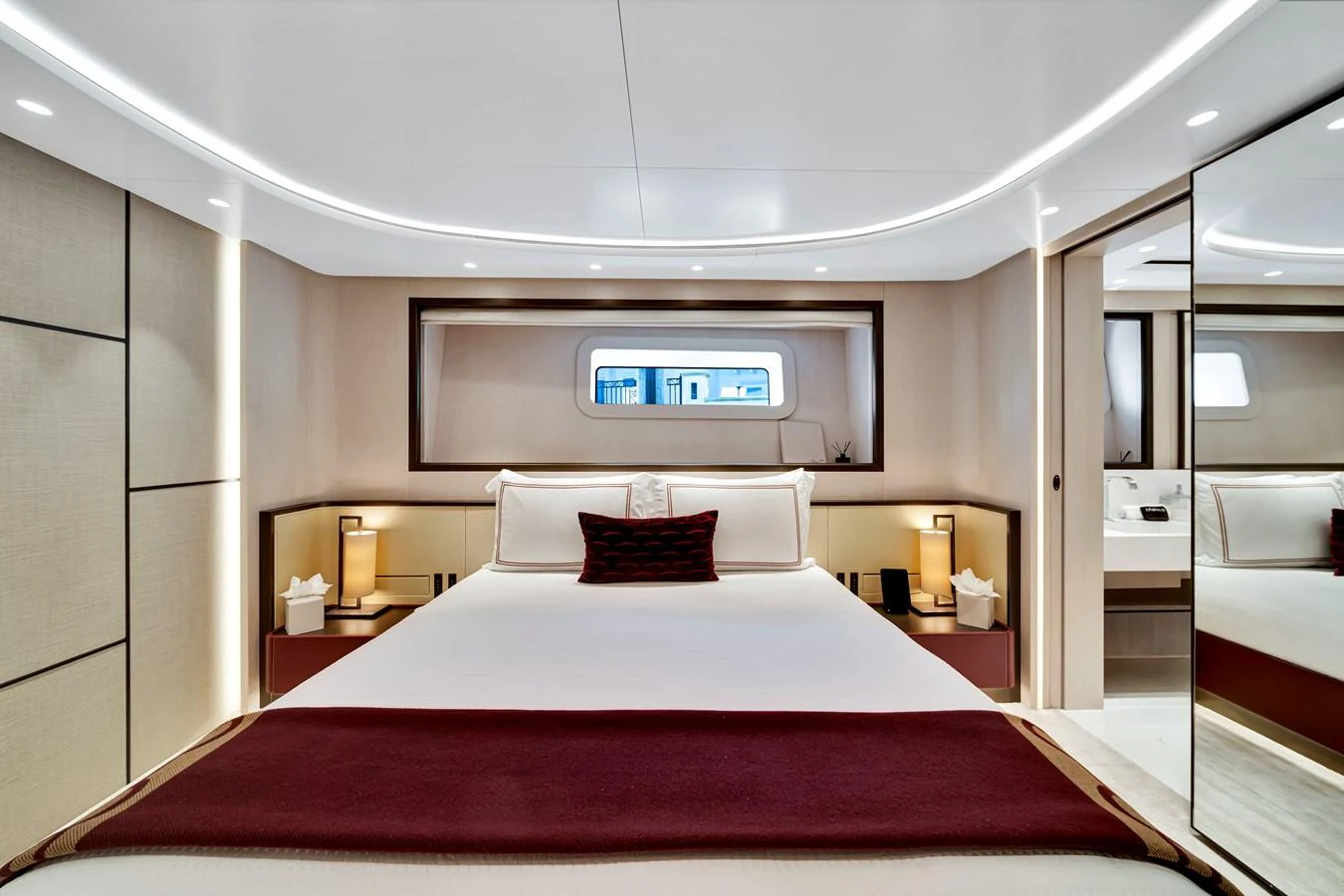 The master stateroom features a luxurious bed with elegant lighting and modern decor. aboard BAGLIETTO DOM 133 #5 Yacht for Sale