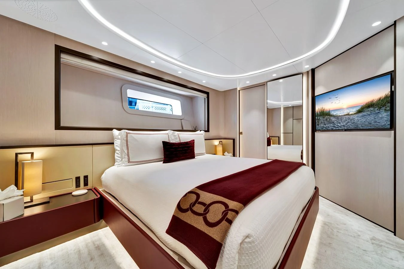 A luxurious stateroom featuring a large bed, modern decor, and ambient lighting. aboard BAGLIETTO DOM 133 #5 Yacht for Sale