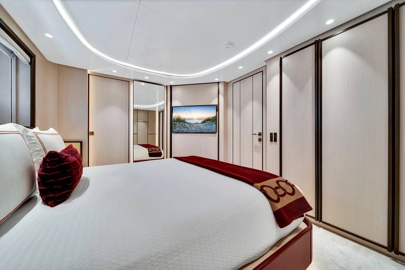 The stateroom features a luxurious bed with elegant decor and ample storage space. aboard BAGLIETTO DOM 133 #5 Yacht for Sale