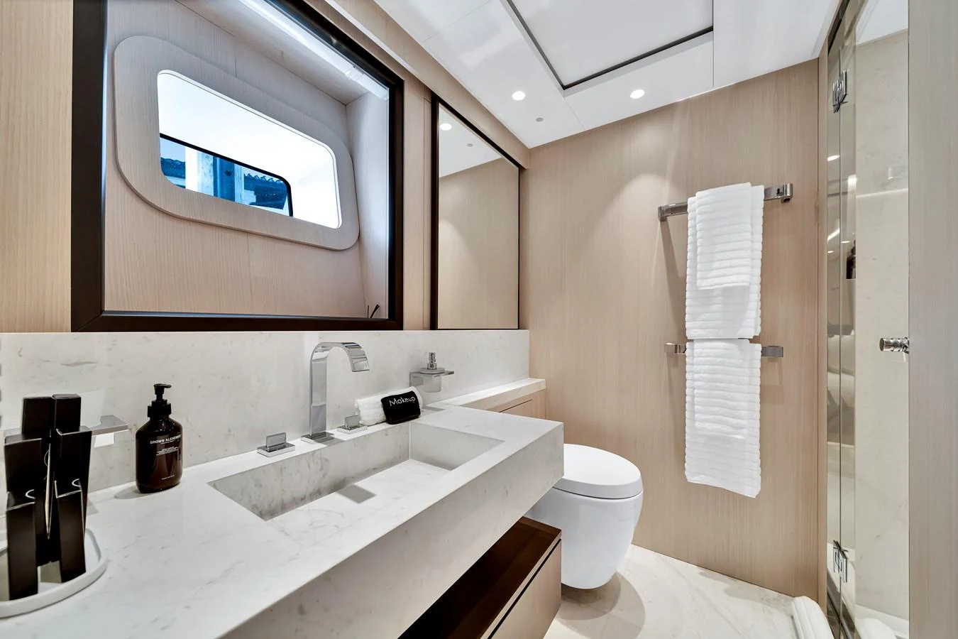 The yacht's bathroom features a sleek, modern design with high-end fixtures and ample natural light. aboard BAGLIETTO DOM 133 #5 Yacht for Sale