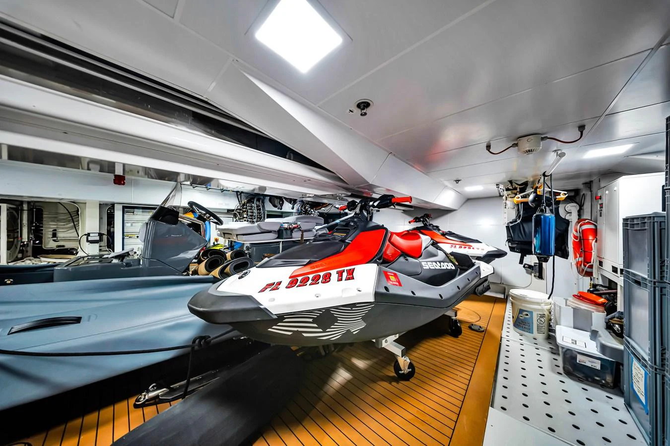 The yacht's garage houses a sleek jet ski, ready for thrilling water adventures. aboard BAGLIETTO DOM 133 #5 Yacht for Sale