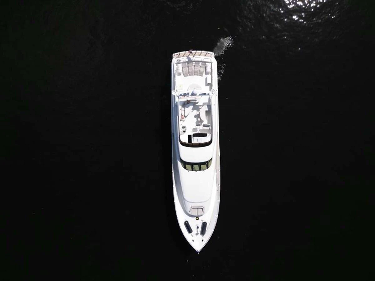 Aerial view of a sleek yacht cruising on dark waters. aboard TRANQUILITY IV - 94 FT LAZZARA MOTORYACHT 2001 Yacht for Sale