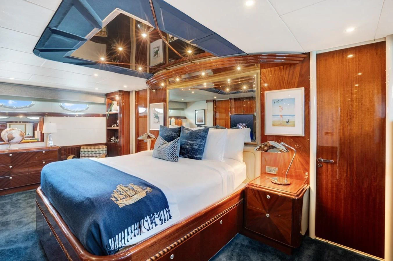 The master stateroom features luxurious bedding and elegant wood finishes, creating a serene and opulent retreat. aboard TRANQUILITY IV - 94 FT LAZZARA MOTORYACHT 2001 Yacht for Sale