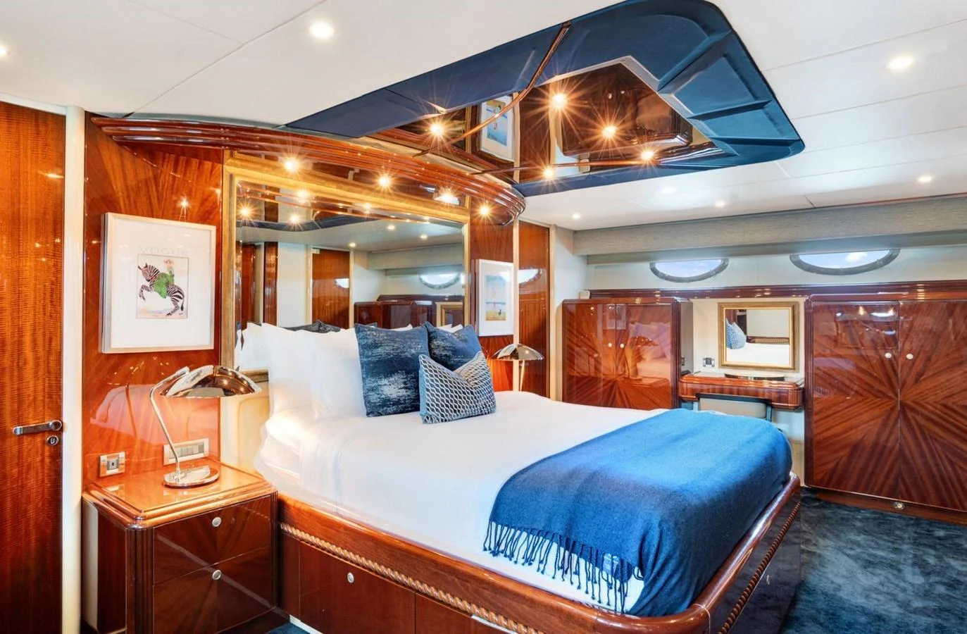 The master stateroom boasts luxurious wood finishes and a plush bed with elegant decor. aboard TRANQUILITY IV - 94 FT LAZZARA MOTORYACHT 2001 Yacht for Sale