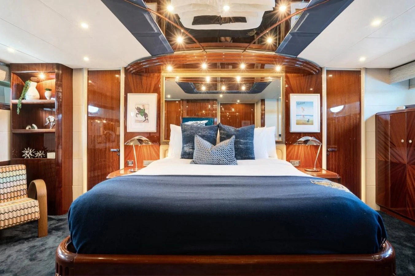 The master stateroom features a luxurious bed with elegant wood paneling and modern decor. aboard TRANQUILITY IV - 94 FT LAZZARA MOTORYACHT 2001 Yacht for Sale