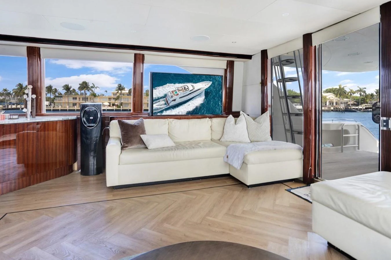 The salon features a comfortable seating area with large windows offering a scenic view. aboard TRANQUILITY IV - 94 FT LAZZARA MOTORYACHT 2001 Yacht for Sale