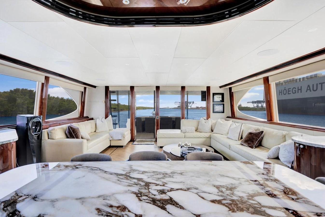 The spacious salon features luxurious seating and panoramic windows offering stunning views. aboard TRANQUILITY IV - 94 FT LAZZARA MOTORYACHT 2001 Yacht for Sale