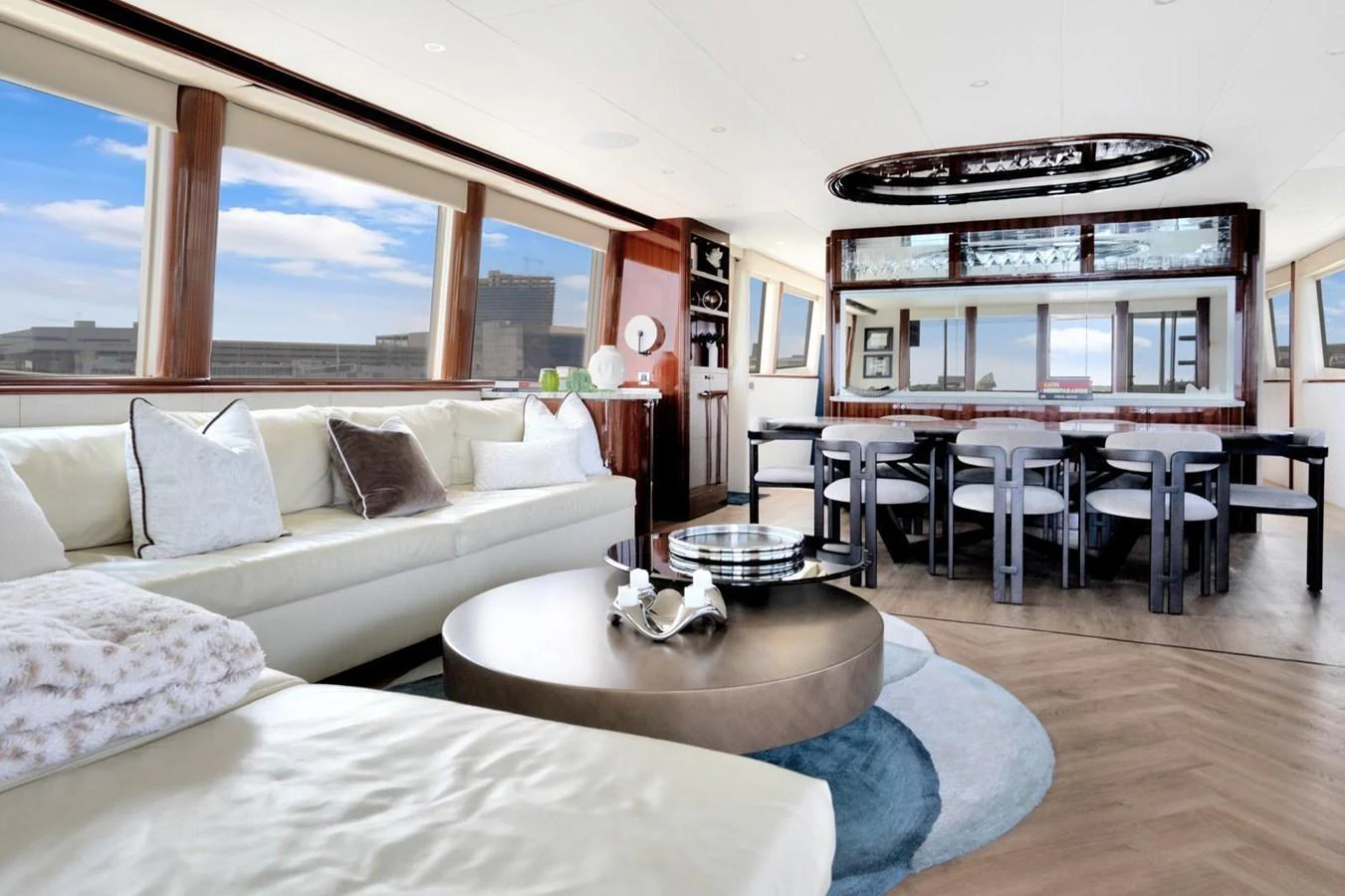 The salon features a spacious and elegantly designed seating area with large windows offering panoramic views. aboard TRANQUILITY IV - 94 FT LAZZARA MOTORYACHT 2001 Yacht for Sale
