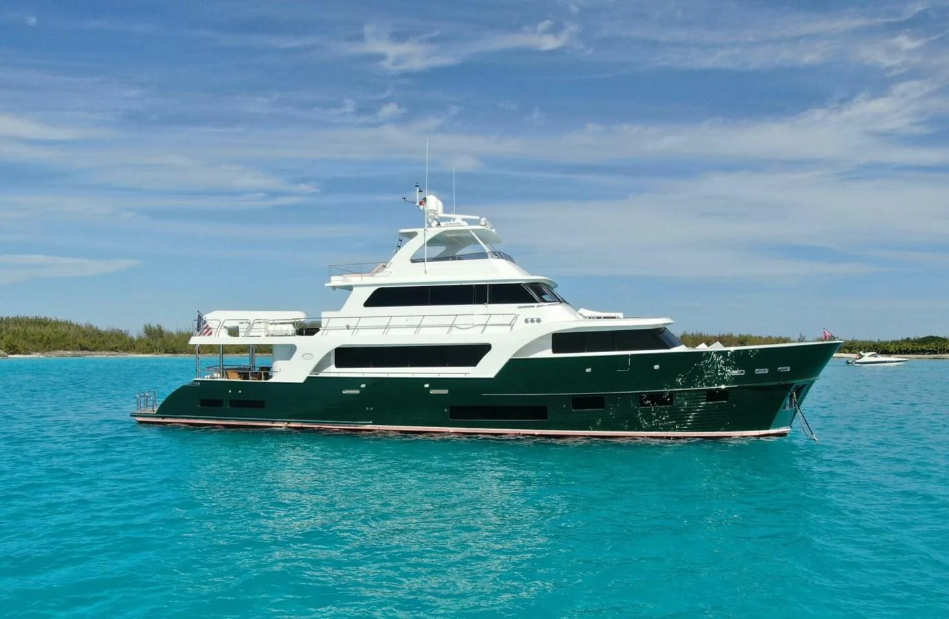 A luxurious yacht cruising in clear turquoise waters under a bright blue sky. aboard ARTEMIS II Yacht for Sale