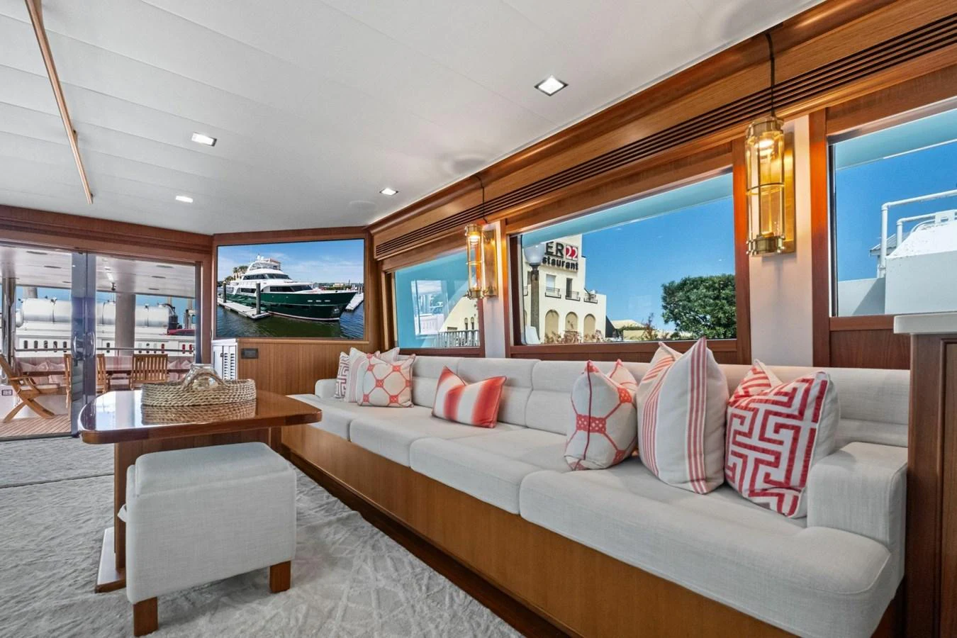 The salon features a spacious seating area with large windows providing ample natural light and scenic views. aboard ARTEMIS II Yacht for Sale