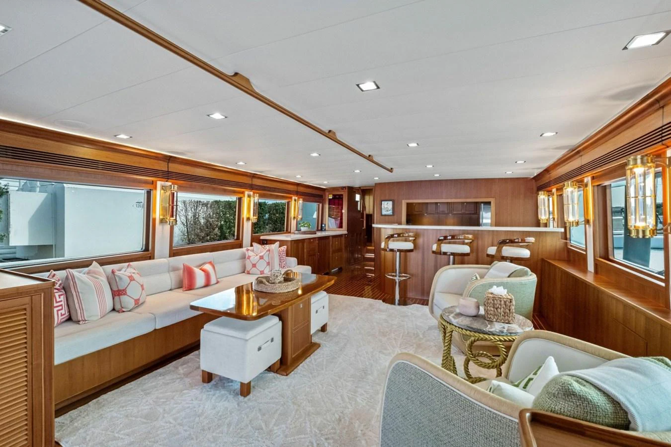 The spacious salon features elegant seating, a dining area, and large windows for natural light. aboard ARTEMIS II Yacht for Sale