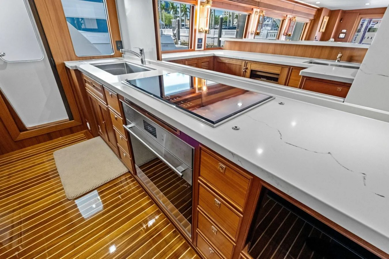 The galley features sleek countertops, modern appliances, and ample storage space. aboard ARTEMIS II Yacht for Sale