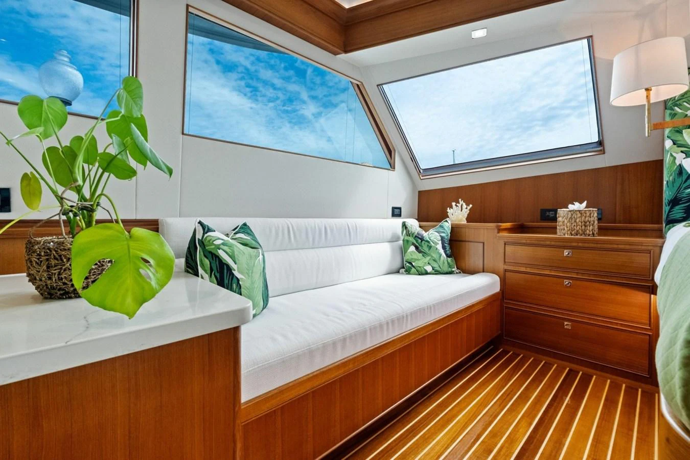 A bright and inviting interior space with large windows and comfortable seating. aboard ARTEMIS II Yacht for Sale