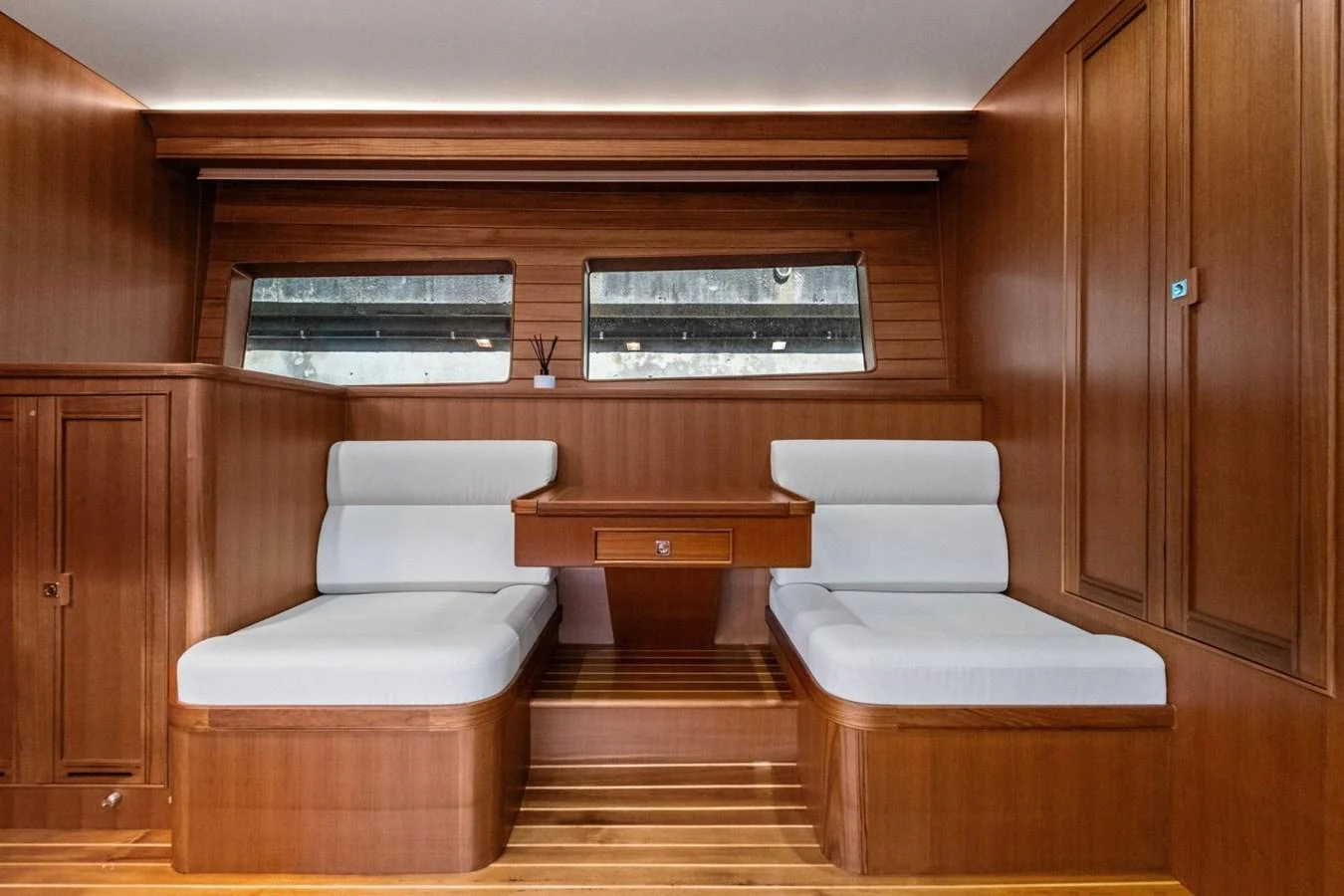 The yacht's interior features a cozy twin cabin with wooden finishes and modern amenities. aboard ARTEMIS II Yacht for Sale