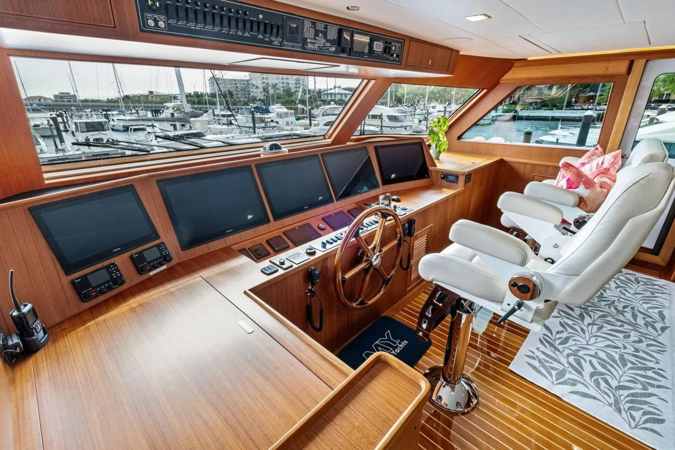 The helm station features state-of-the-art navigation equipment and luxurious seating with a panoramic view of the marina. aboard ARTEMIS II Yacht for Sale