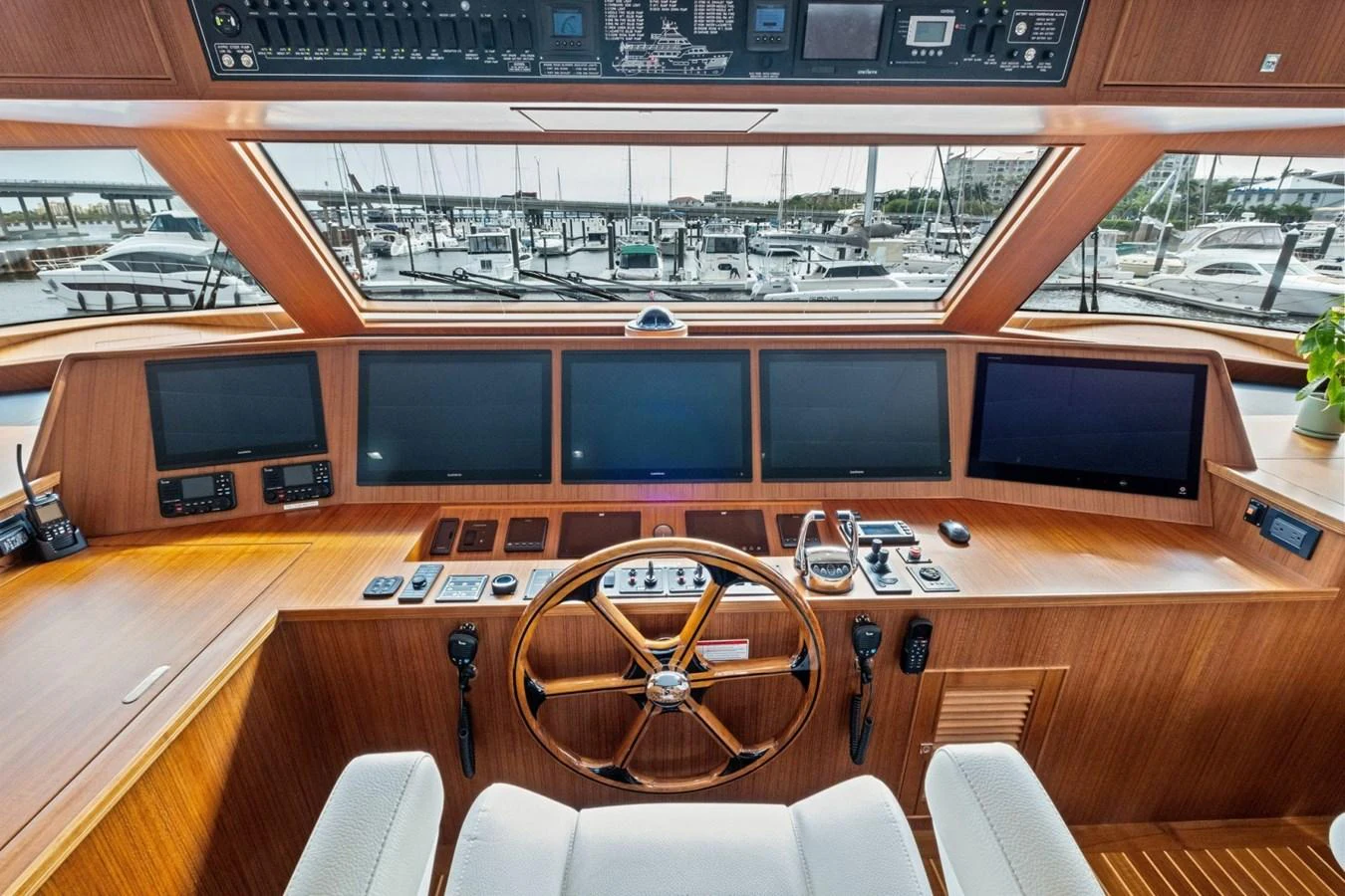 The helm station features a sophisticated array of navigation equipment and a commanding view of the marina. aboard ARTEMIS II Yacht for Sale
