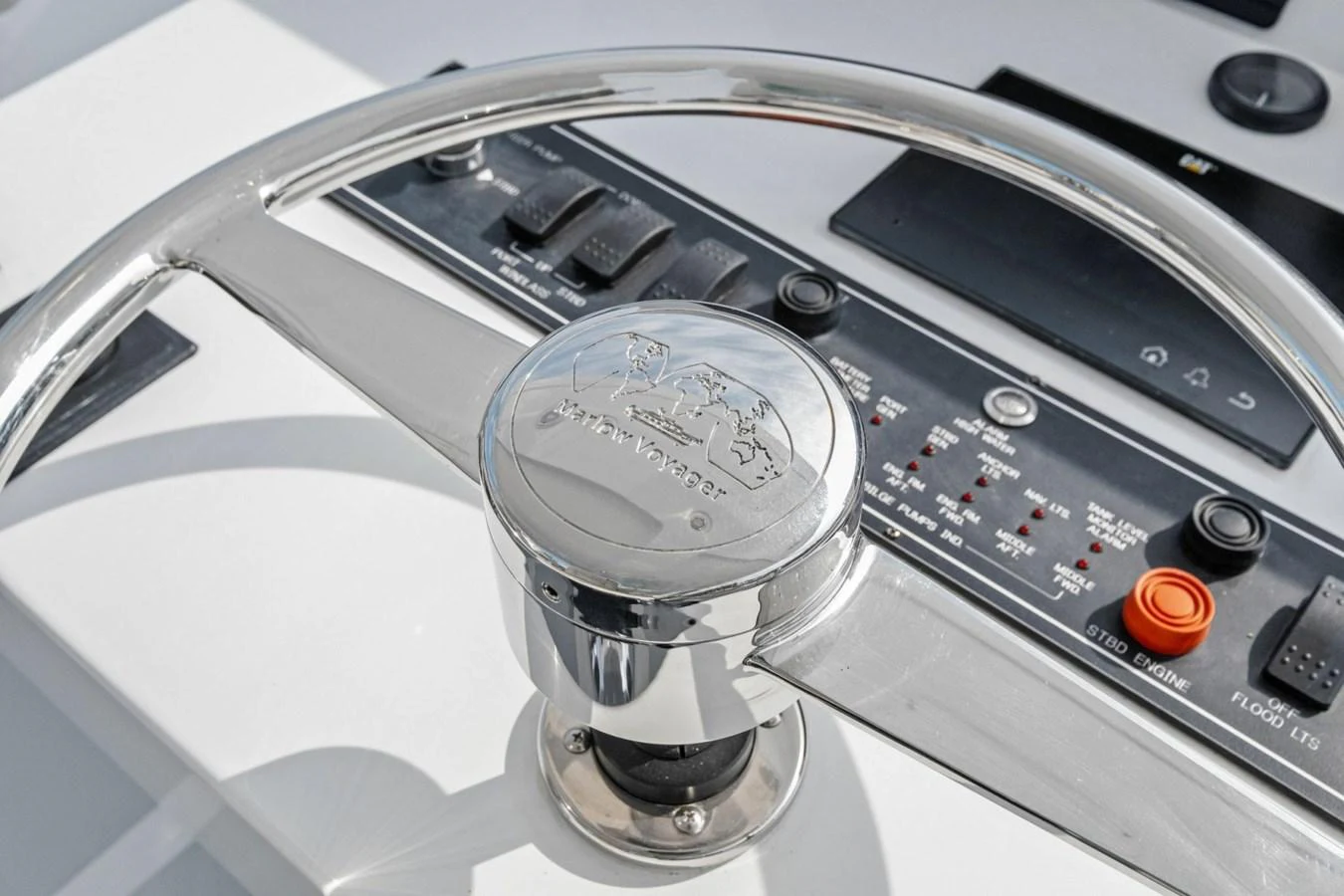 A close-up view of the yacht's helm showcasing the steering wheel and control panel. aboard ARTEMIS II Yacht for Sale