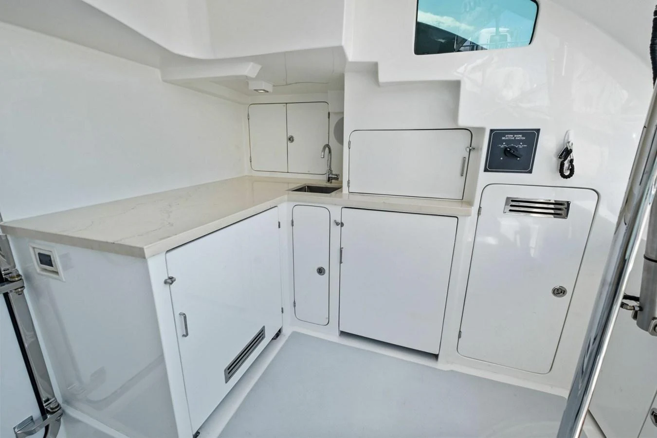 The yacht's galley features a sleek, modern design with ample storage and counter space. aboard ARTEMIS II Yacht for Sale