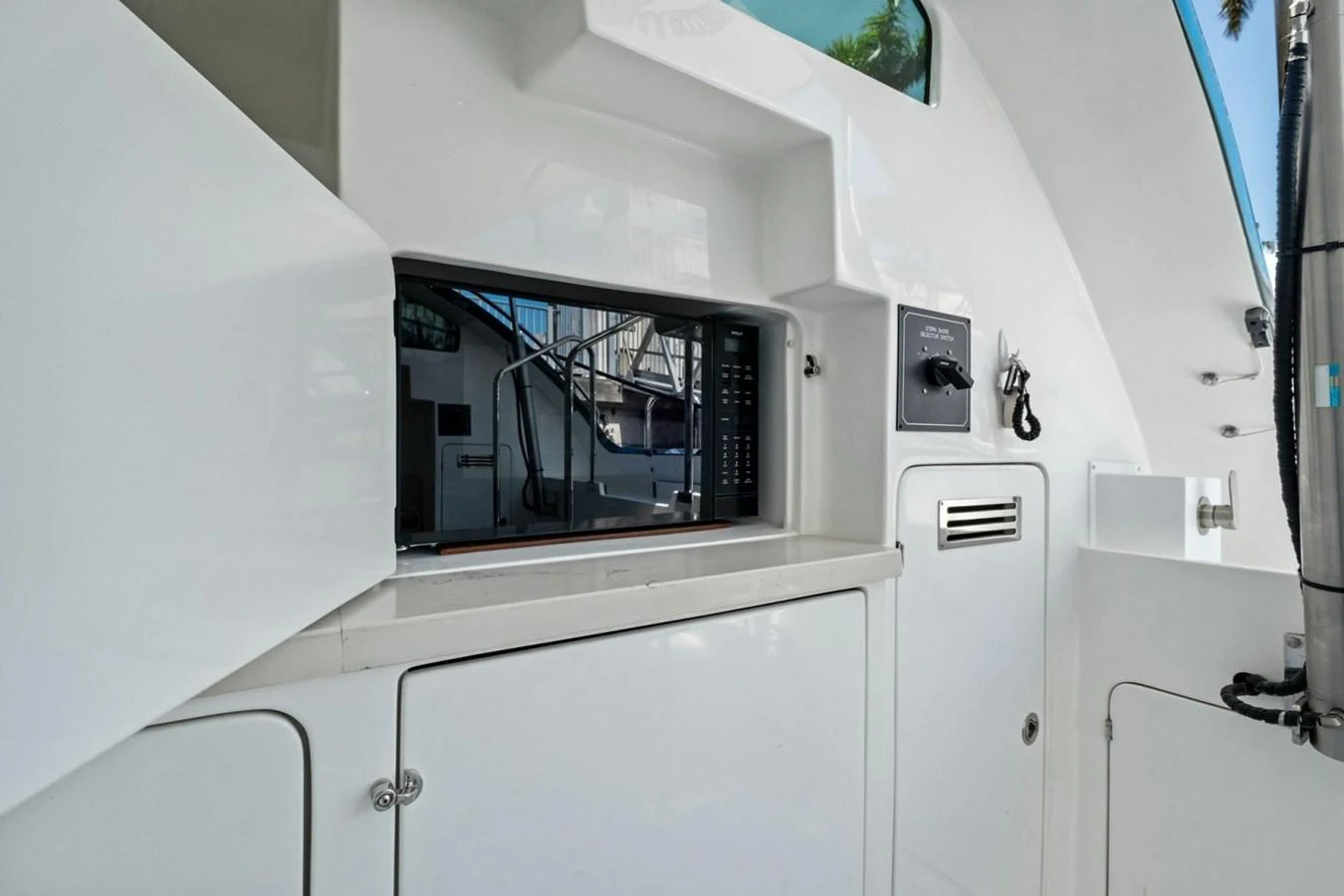 A close-up view of a yacht's built-in microwave and storage compartments. aboard ARTEMIS II Yacht for Sale