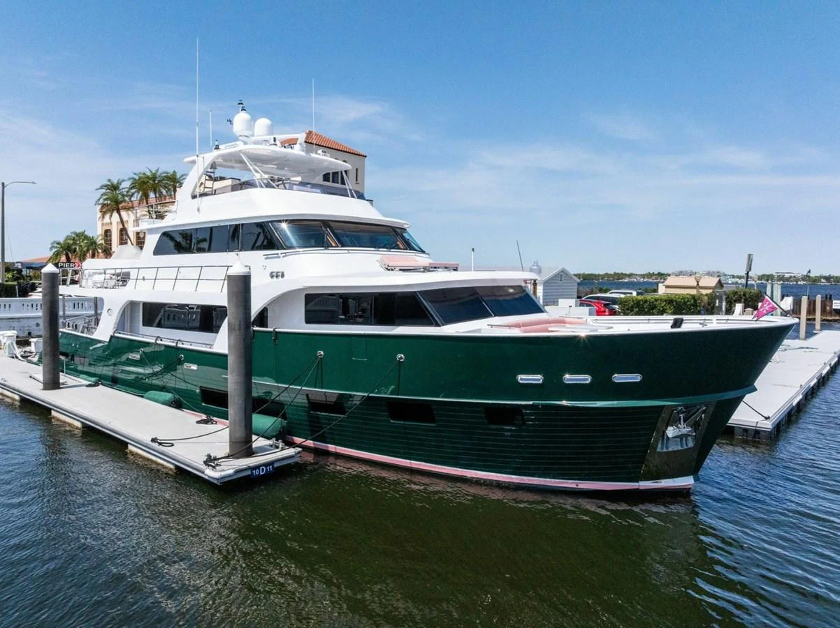 A luxurious yacht docked at a marina, showcasing its sleek design and spacious decks. aboard ARTEMIS II Yacht for Sale