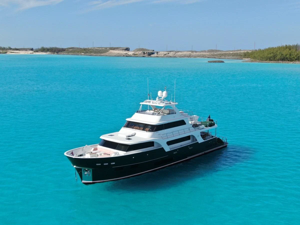 A luxurious yacht cruises through pristine turquoise waters, showcasing its elegant design and spacious decks. aboard ARTEMIS II Yacht for Sale