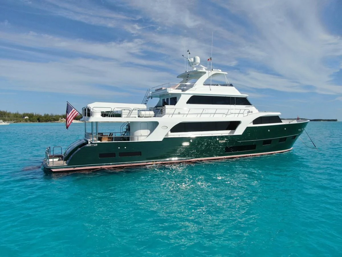 A stunning yacht floats gracefully on clear turquoise waters under a bright blue sky. aboard ARTEMIS II Yacht for Sale