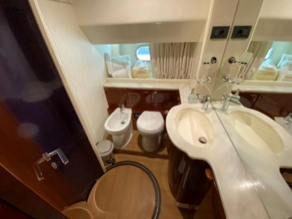 The yacht's bathroom features a sleek design with modern fixtures and ample lighting. aboard FERRETTI 810/78 Yacht for Sale
