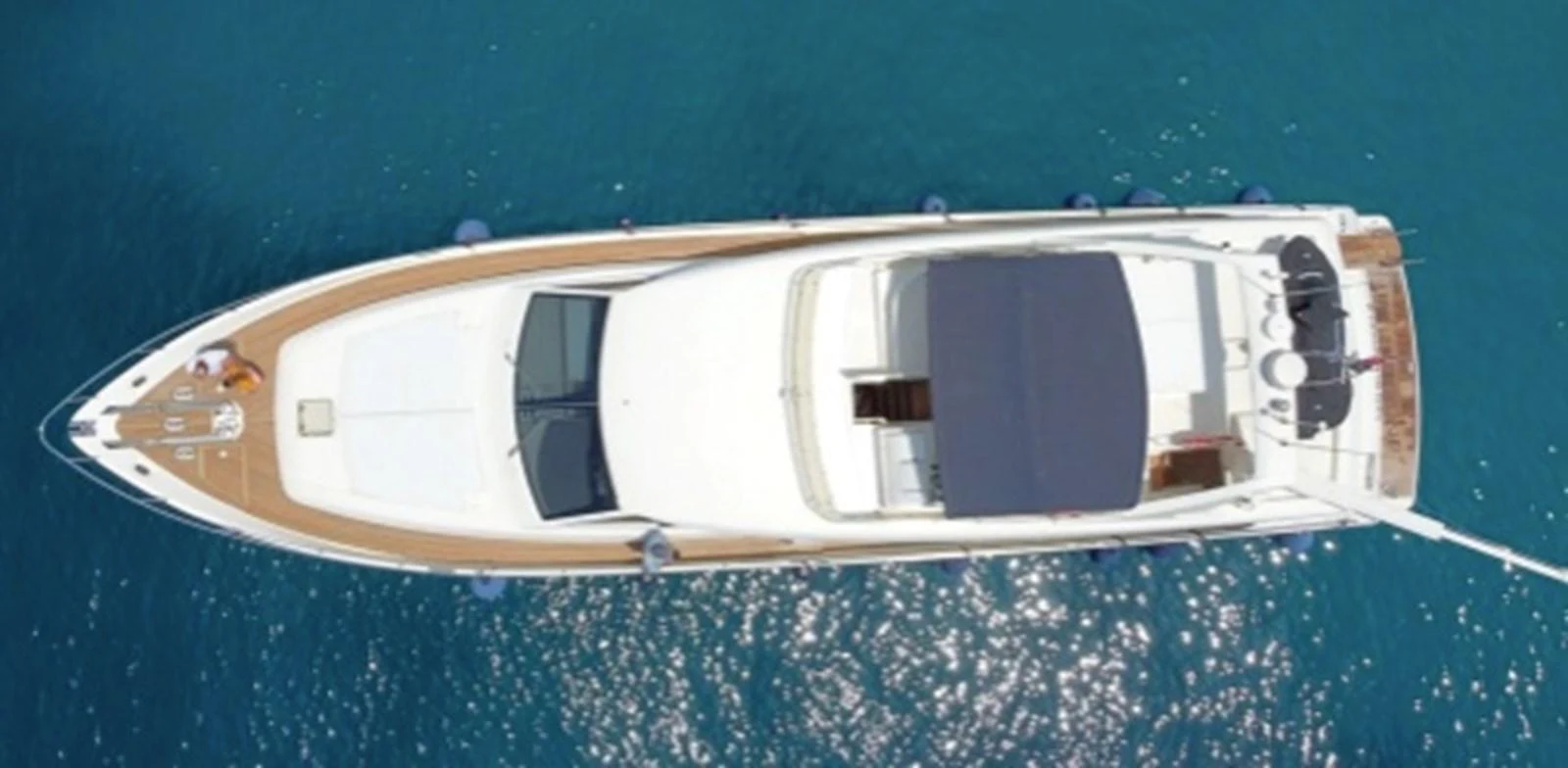 Aerial view of a sleek yacht cruising on clear blue waters. aboard FERRETTI 810/78 Yacht for Sale