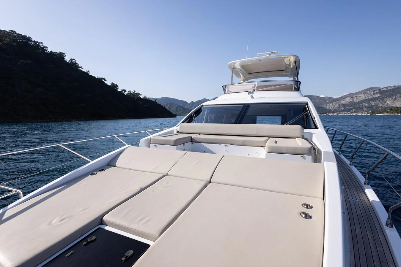 The yacht's foredeck features spacious sun pads for ultimate relaxation while cruising. aboard AZ FLY 66 Yacht for Sale