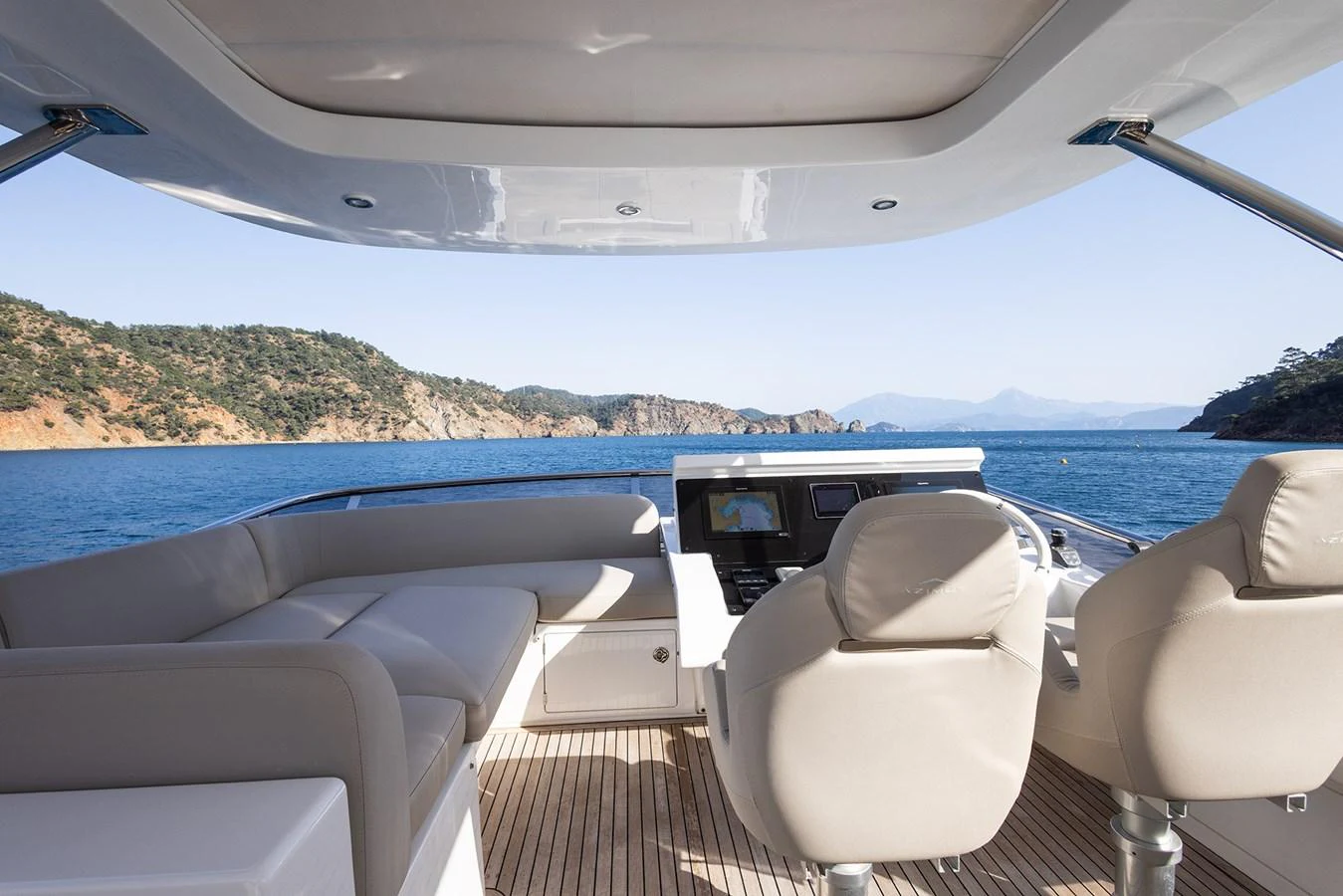 The yacht's helm offers a luxurious and comfortable seating area with stunning views of the surrounding waters. aboard AZ FLY 66 Yacht for Sale
