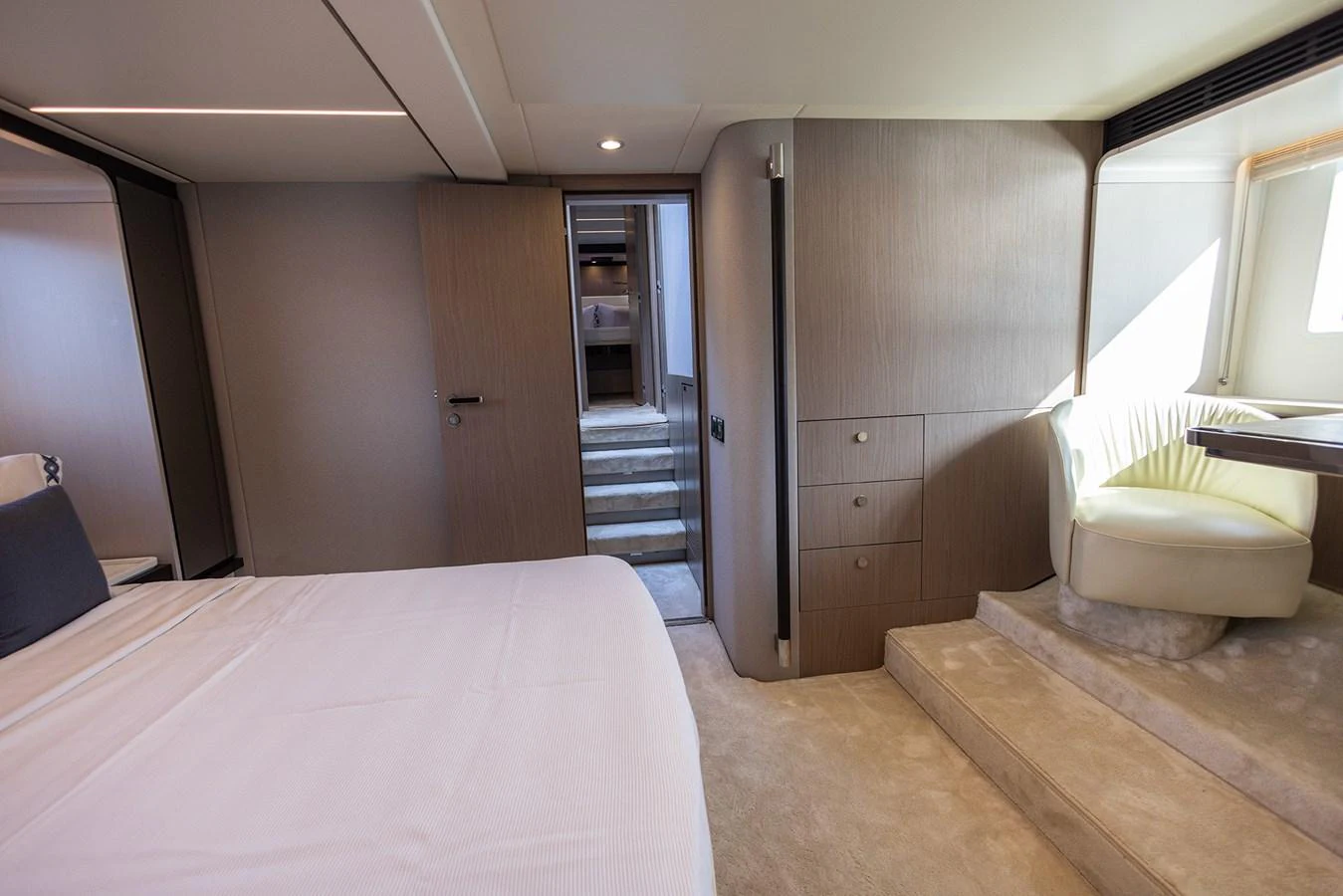 A luxurious stateroom featuring a comfortable bed, elegant seating area, and ample storage. aboard AZ FLY 66 Yacht for Sale