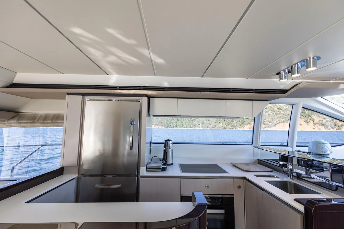 The modern galley offers a sleek and functional space with stunning views of the water. aboard AZ FLY 66 Yacht for Sale