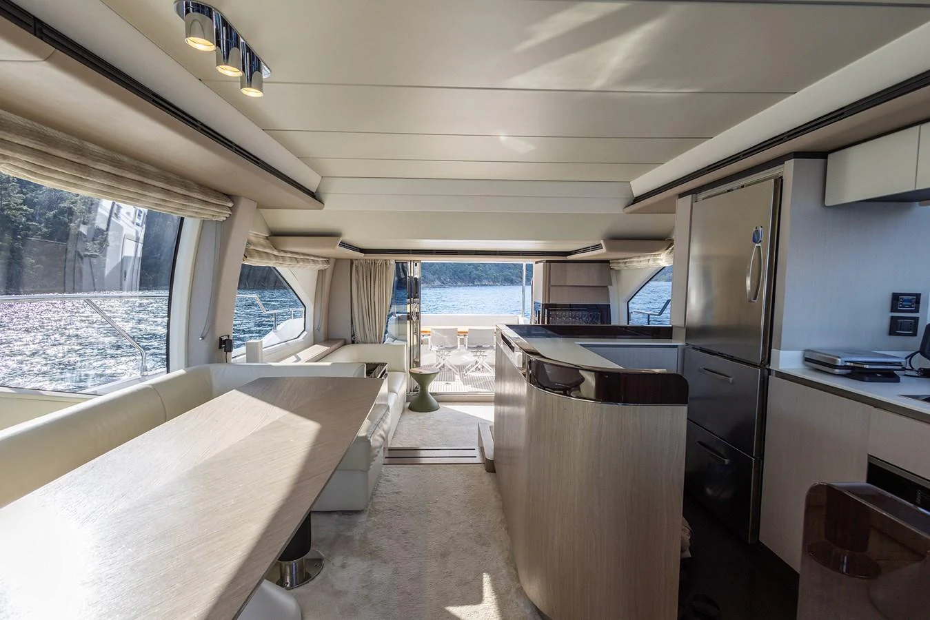 The yacht's salon features a spacious and modern design with ample natural light and elegant furnishings. aboard AZ FLY 66 Yacht for Sale